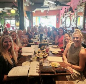 JLCD Members at a restaurant table planning for Art Harvest.